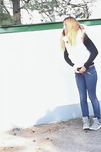 Black-haired is all clingfilmed up while pissing