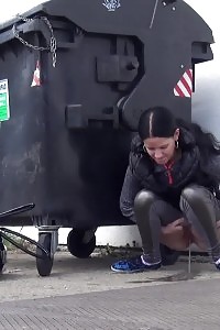 Brunette doll is desperate to piss when walking