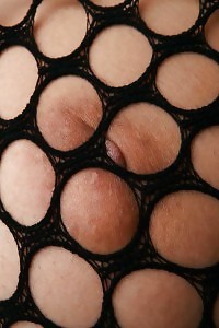 Breathtaking Asian honey exhibits off her boobies and her cunt in  nylon undie