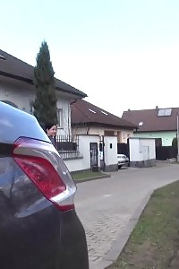 Nice-looking princess pisses behind a parked vehicle on the grass