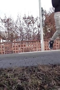 Black-haired bitch needs to piss while walking by a road