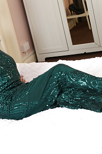 Lala Star adorned in shiny star green evening gown and pantyhose through you can see her hairy snatch