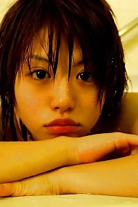 Hitomi Hayasaka Asian seductress unclothing for a hot shower exhibiting nude wonderful body