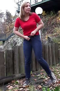 European babe in red tee pisses on fallen leaves
