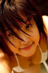 Irresistable Japanese princess is stripping off her clothes exploring her delightful body in her thong