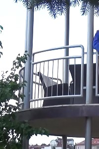 Magnificent ginger pisses over her balcony
