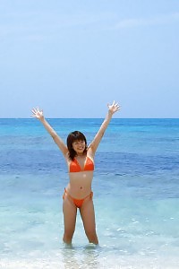 Asian chick likes being nude at the seaside exploring hairy cunt off for photos