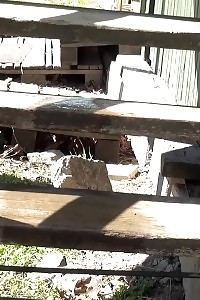 Magnificent dark haired babe sprays her pee onto steps