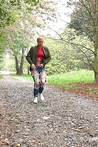 Blonde doll Chrissy relieves herself on a path