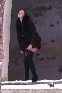 Suburb peeing in the snow for dark haired Dasha