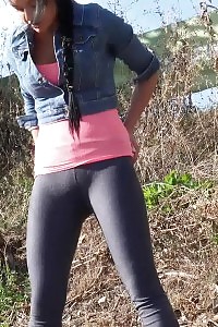 Adorable brunette queen pissing on the grass