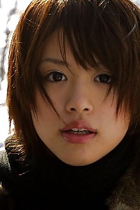 Hitomi Hayasaka Lewd Asian model displays butt and pussy in the snow