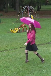 Black-haired pornstar shows her bearded pussy while peeing