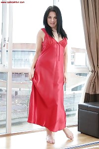 Jessica exposes her impressive body and sexy legs against the window