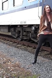 Cynthia Vellons pisses next to a railway line