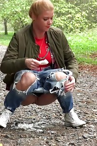 Blonde doll Chrissy relieves herself on a path