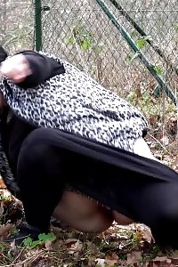 Plumpy doll squats outside to piss outdoor